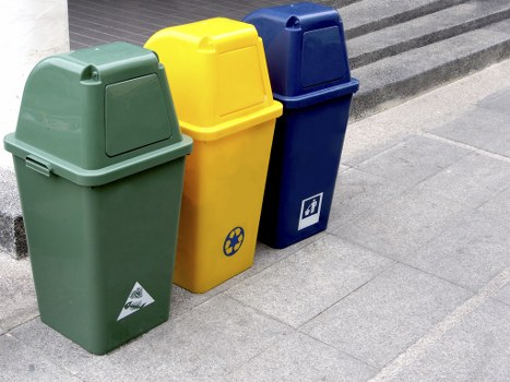 Workers sorting office waste into recycling bins during a Mortlake clearance